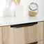 CUTT aluminium handle with minimalist architectural design mounted on a contemporary kitchen cabinet drawer front.