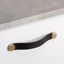 FLEXA leather and zamak handle with warm contemporary design mounted on a modern wardrobe drawer front.