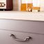 PENDANT zamak ring handle with vintage design mounted on a contemporary cabinet drawer front.