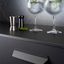 PLIÉ zamak handle with folded industrial geometric design mounted horizontally on a contemporary cabinet drawer front.