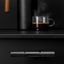 POINT aluminium T-handle with textured dotted grip and industrial design mounted on a contemporary cabinet drawer.