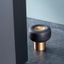 BUGGY aluminium door stopper in Brushed Brass or Lava Black with smooth aerodynamic design.