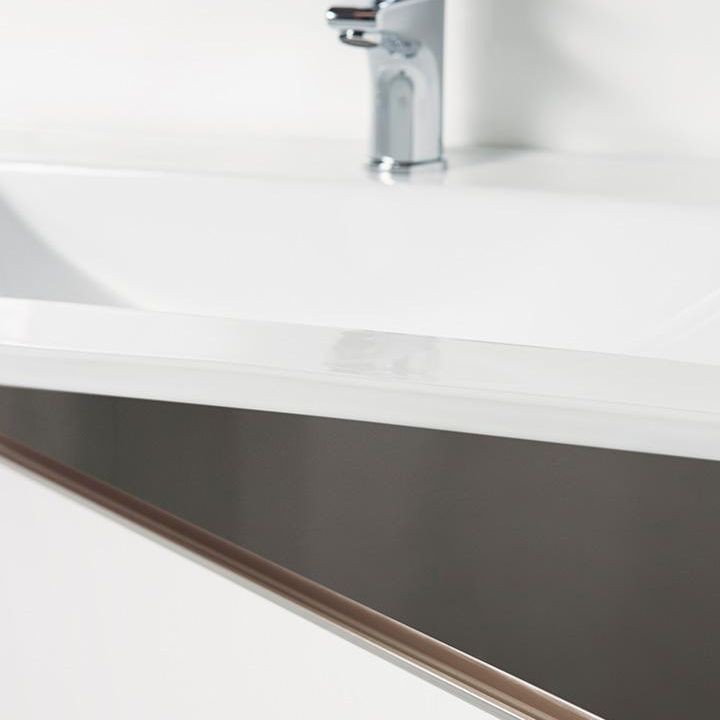JEY2 semi-hidden aluminium edge handle with a sleek minimalist profile in a brushed brass finish.