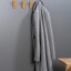 SWITCH wooden wall hook in Oak, Walnut, Matt White Lacquered Ash or Matt Black Lacquered Ash.