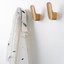 LUV WOOD wooden wall hook in Oak, Walnut or Matt Black Lacquered Oak with organic shape.