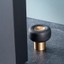 BUGGY aluminium door stopper in Brushed Brass or Lava Black with smooth aerodynamic design.