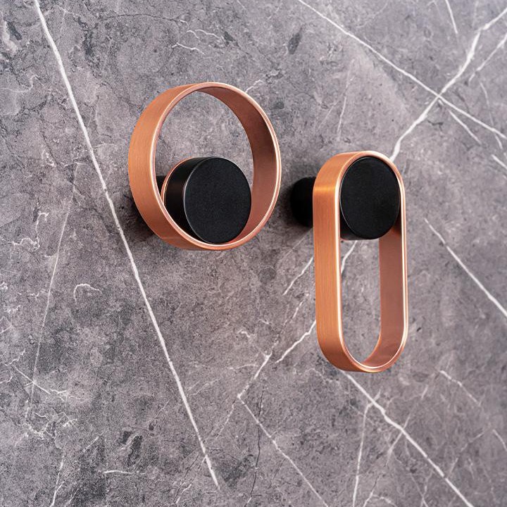 ORBIT Zamak-Wandhaken in Mattschwarz mit Gold gebürstet oder Kupfer gebürstet.