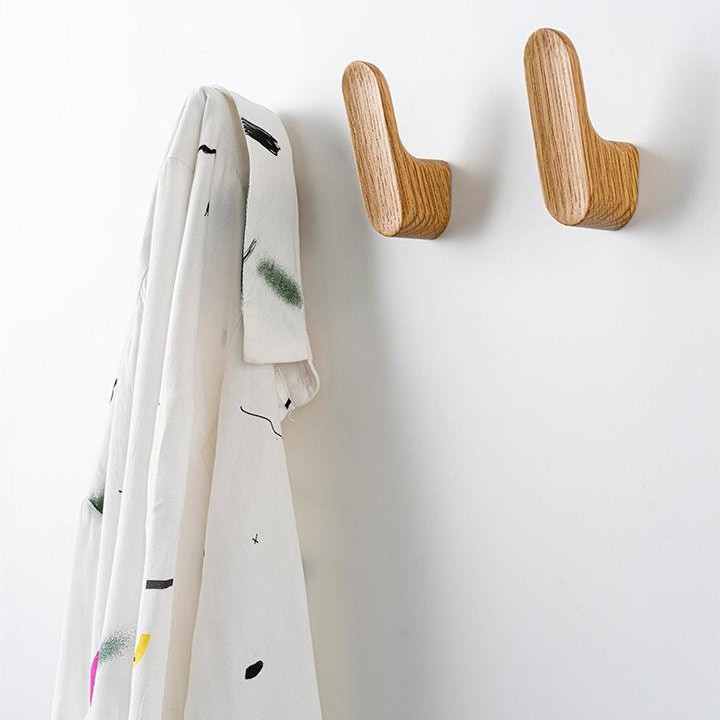LUV WOOD wooden wall hook in Oak, Walnut or Matt Black Lacquered Oak with organic shape.