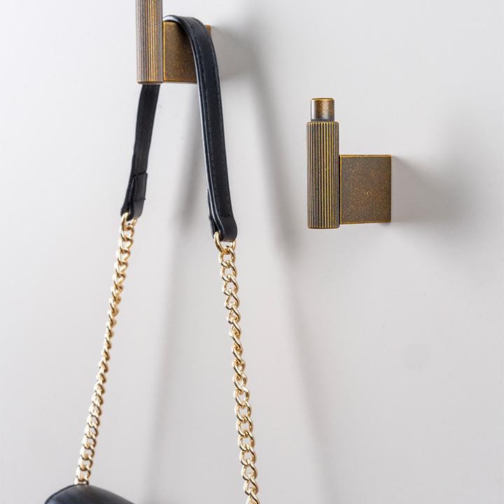 ARPA zamak wall hook in Stainless Steel Look, Brushed Black, Brushed Dark Brass or Rustic Brass.