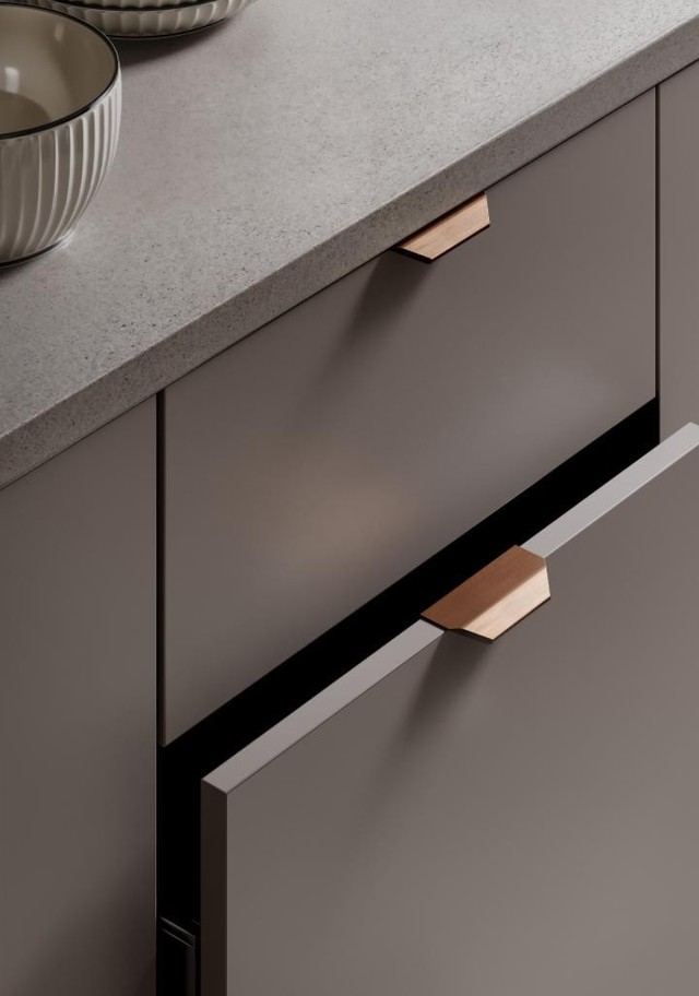 VANN aluminium profile handle with clean straight lines, seamlessly integrated into a contemporary cabinet drawer.