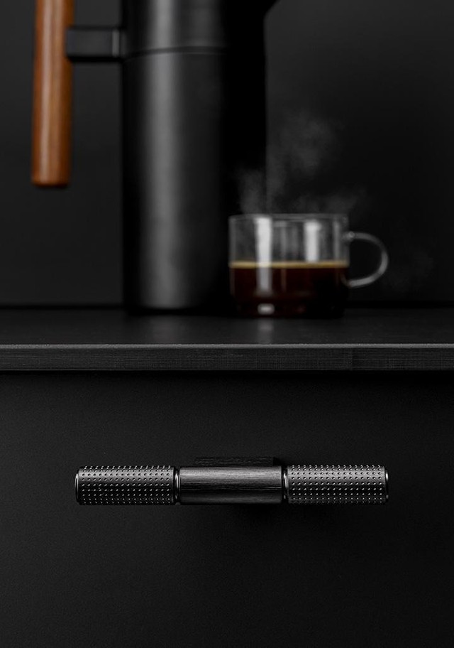 POINT aluminium T-handle with textured dotted grip and industrial design mounted on a contemporary cabinet drawer.